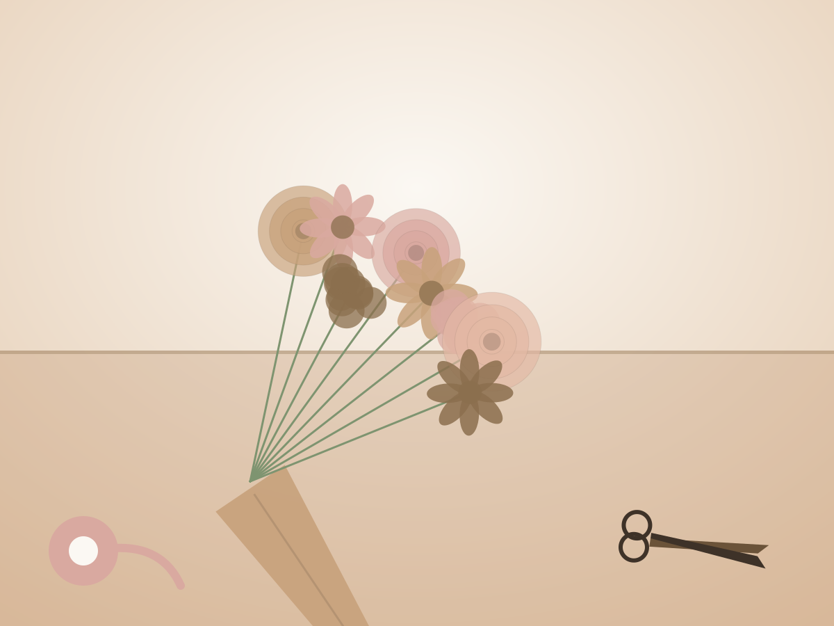 A freshly hand-tied bouquet resting on the work table, beside a ribbon spool and shears